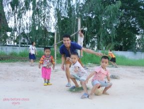 Chen with his students on the playground
