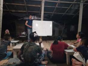 Chen teaching English, Shan, and Burmese languages