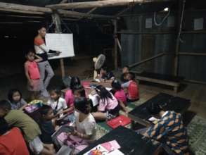 Chen teaching English, Shan, and Burmese languages