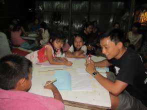 Awn Khay teaching Shan to migrant children