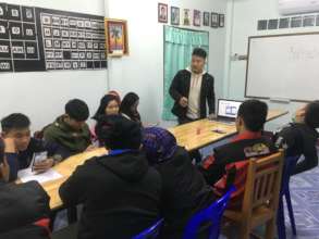 Weh giving a training on technology at his church