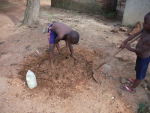 David mixing mud to build