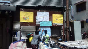 Action Event participants putting up posters