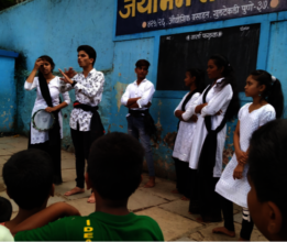 Girls supporting participants during action event