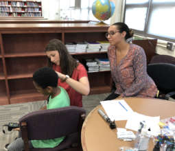 A hearing screening test is given to a child