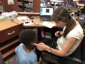 Our audiologist explains screening to young child