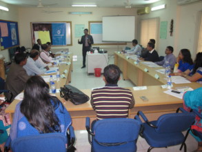 Dr. Reza providing training to PEP partner NGOs.