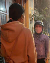 Photos of peer educators conducting outreach to wo