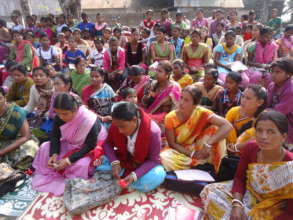 Monthly mothers meeting in slum