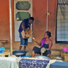 Our team member handing over a bar of soap