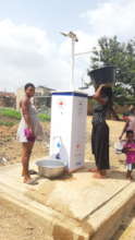 Women conveniently draw water from standpipe