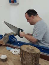 Zeevi sawing in carpentry workshop