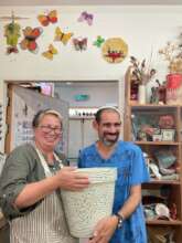 Hezi showing off his latest ceramic creation