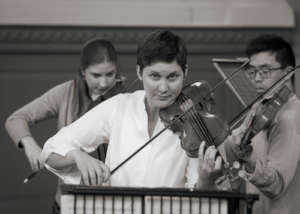 Second violins in rehearsal