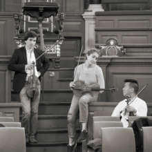 Colleagues taking a moment mid-rehearsal
