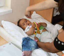 Roza measuring Anna's growth and development