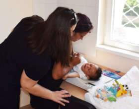 Baby Anna getting weighed