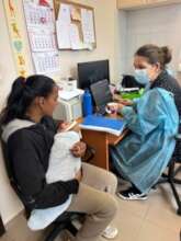 Yulia and her baby on their pediatric check-up
