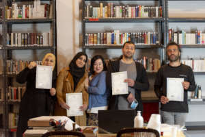 Posing with teacher and hard earned certificates!