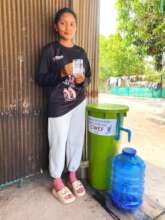 Recipient standing proudly with her new filter