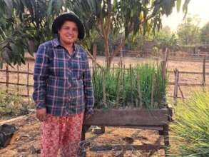 Sarer works in her rice fields