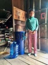 A Dal villager receiving a biosand water filter