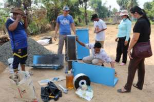 Koy Thea constructing BioSand Water Filters