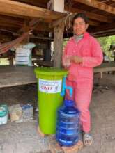 Sokhim with the biosand water filter you gave her!