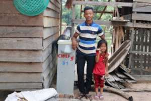 Father and daughter with their BioSand filter