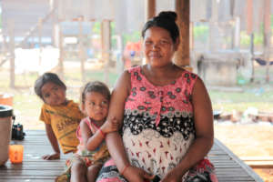 Seur Siek at home with her daughters