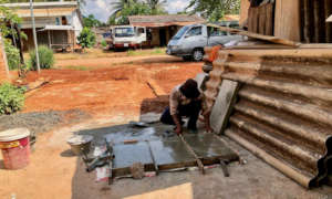 Volunteers in Tboung Khmum prepare BioSand Filters