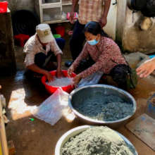 Volunteers in Tboung Khmum prepare BioSand Filters