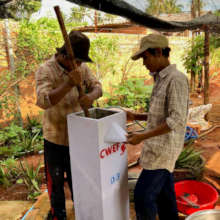 Volunteers in Tboung Khmum prepare BioSand Filters