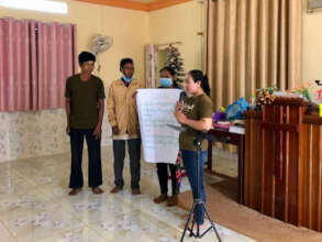 Chantou shares with the group during HEAL training