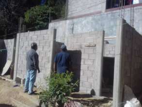 Working on Ms. Elodias house with local volunteer