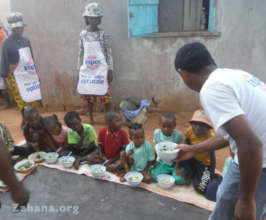 Serving solar cooked noodle with Moringa soup