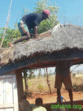 Fixing the shade paviallion in the school yard