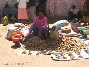 Potato vendor in a market in Madagascar