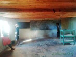 Painting the classroom with white clay