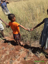 Holding hands with seed balls