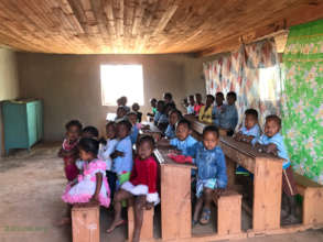 Younger students in one half of the classroom