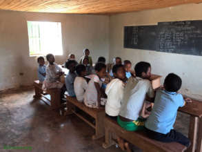 Older Students in thier partition of the classroom