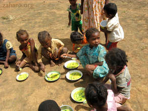 Children eating soup in the school