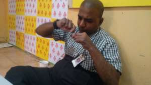 The Warli Artist now engaged in another task