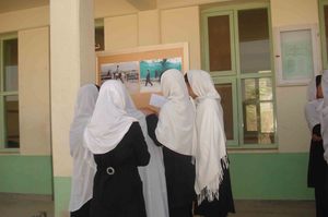 Girls from a Kabul school discuss the exhibition