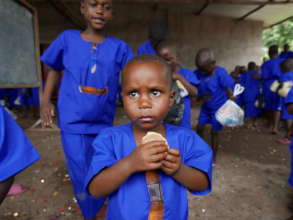 Child eating bread at Murakaza school