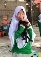 Student interacting with a cat