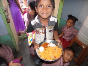 Children with hot served nutritious midday meal