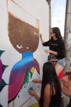 Young Girls painting anti-violence art