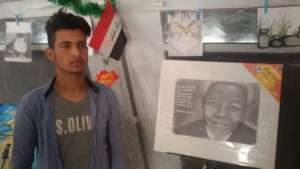 A. with his drawing of Nelson Mandela